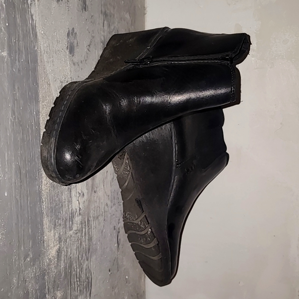 Clark's black leather shoes.